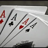 Four aces on a table