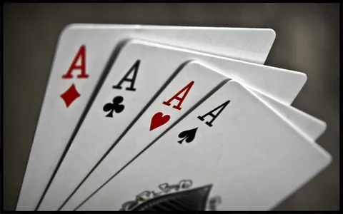 Four aces on a table