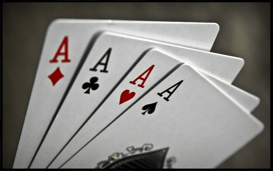Four aces on a table